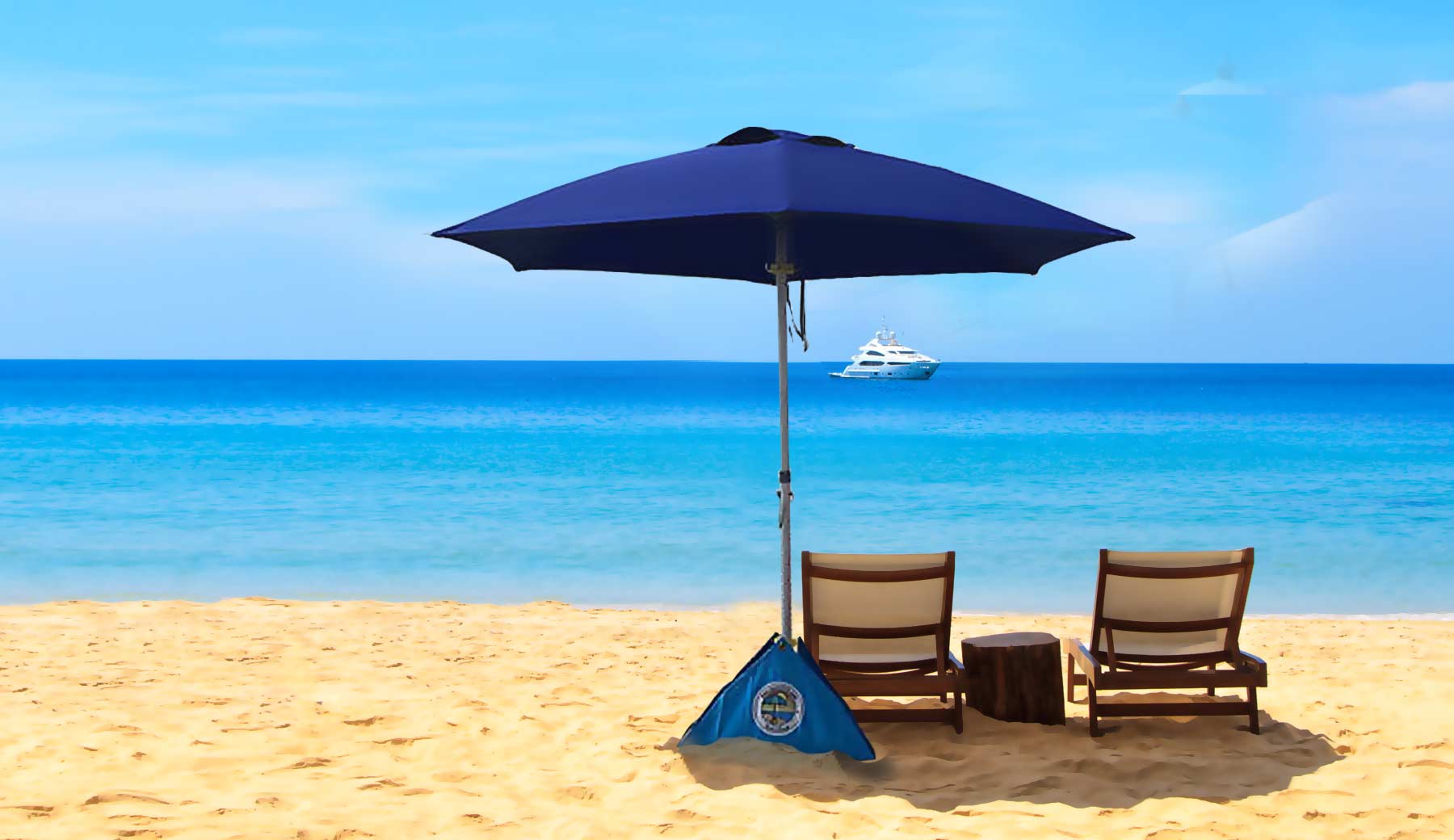 beachBUB beach umbrella set up at the beach with two lounge chairs